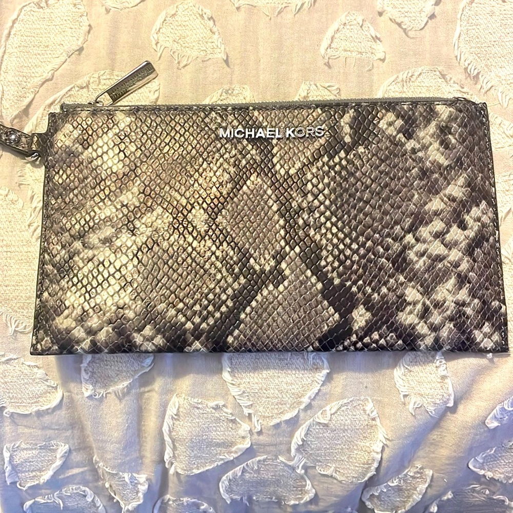 Michael Kors large wristlet.  Zip top opening inside card slots Snakeskin look